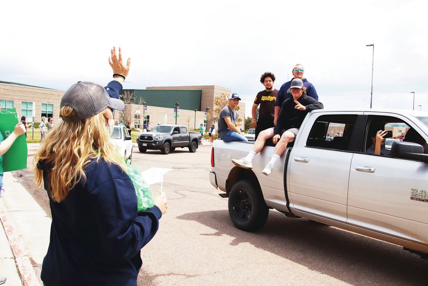 Truck beds were a popular conveyance for students at the ThunderRidge High School graduates’ parade.