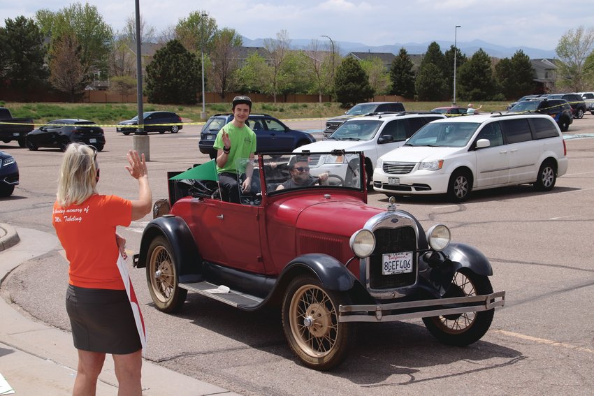 Some ThunderRidge High School students arrived for their parade of seniors in antique cars.