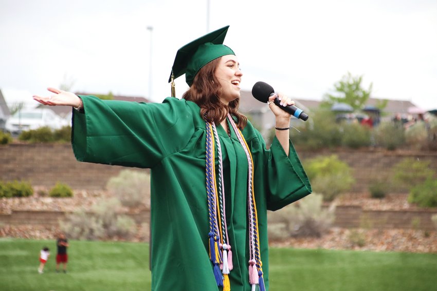 A Mountain Vista High School graduate sings during the June 26 graduation ceremony.
