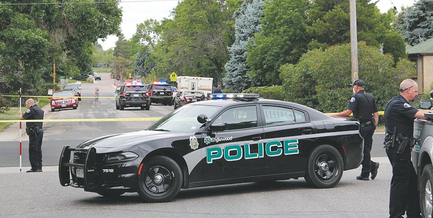 A file photo shows Englewood Police responding to a June crash of a suspect’s car and a parked vehicle near West Kenyon Avenue and South Galapago Street.