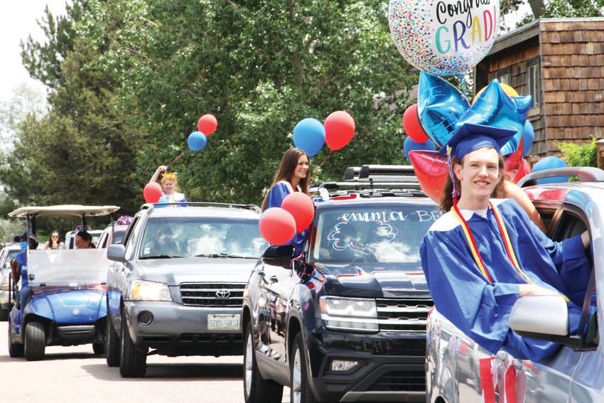Hundreds of cars — many with balloons, words and other decorations adorning them — drove slowly past Cherry Creek High's staff members, who cheered them on.