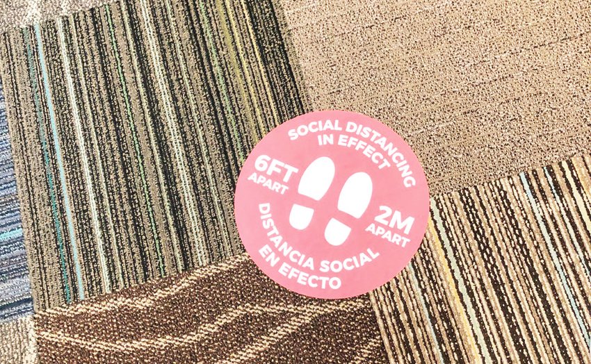A social distancing decal on the floor of the newly reopened Golden Public Library.