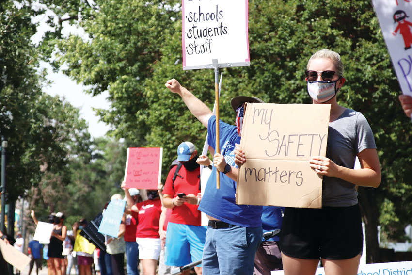 Teachers union members lined Wilcox Street outside the Douglas County School District administration building at a rally on July 22, 2020.