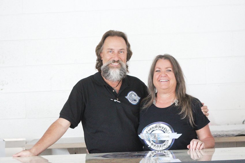Andy and Lisa Hawker, owners of the Filling Station Tap House, pose for a photo. The couple has been planning to open the tap house for the past five years.