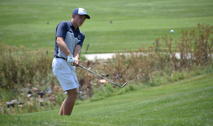 Columbine senior Drex Duffy watches his chip up to the green during the second Jeffco League boys golf tournament of the season Monday, Aug. 17, at Raccoon Creek Golf Course in Littleton. Duffy shot a round of 76.