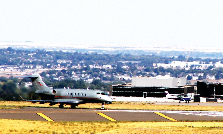 A private jet taxis in after landing at the Rocky Mountain Municipal Airport Sept. 2. The airport was one of several front range airports that received federal grants for work. In Rocky Mountain's case, the money will pay for long-awaited repairs to the airport's taxiway.