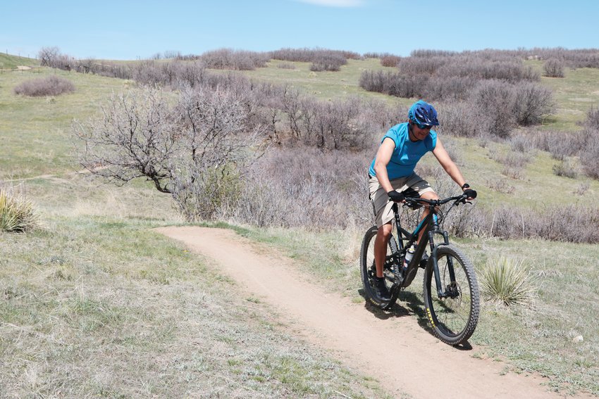 A mountain biker rides on a trail in Highlands Ranch.