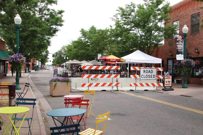 Portions of Arvada's Olde Town streets have been blocked off with road signs like this, allowing residents to walk along the streets, and allowing eateries to offer more outdoor eating space.