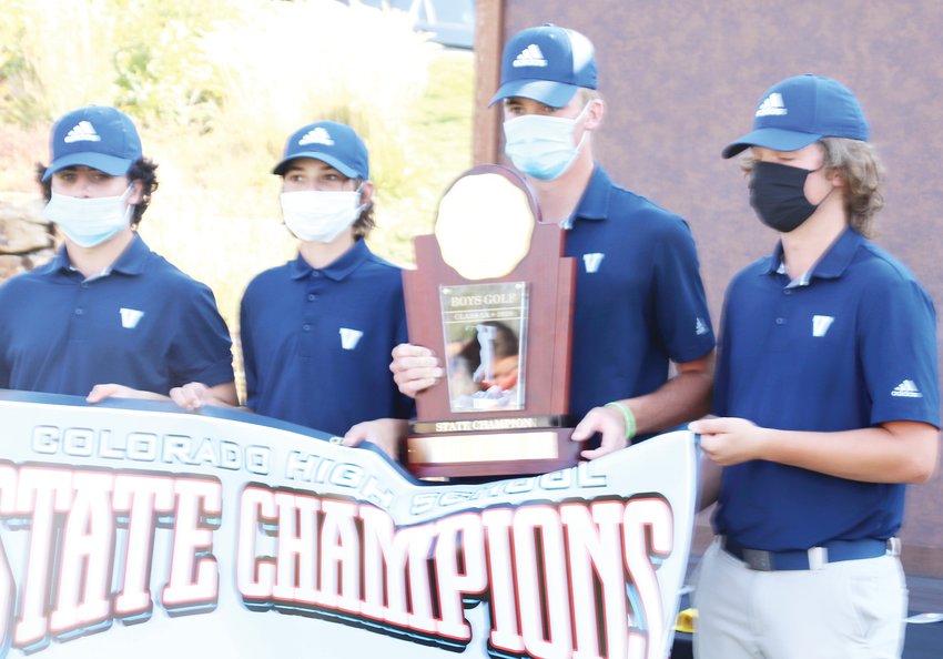 State champion Lucas Schultze of Valor Christian, holding the trophy, eagled the 18th hole which clinched the state title for the Eagles and gave Schultze the individual title.