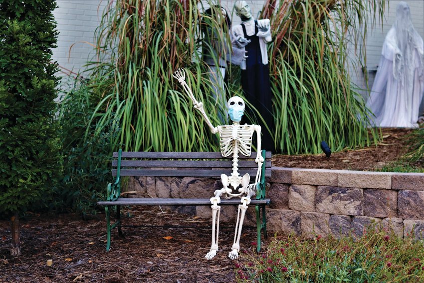 A masked skeleton sits outside a home in Centennial.