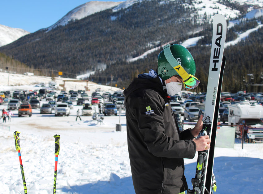 Jack Wrigley, 15, inspects his skis as he waits at Loveland Basin during Opening Day on Nov. 11.