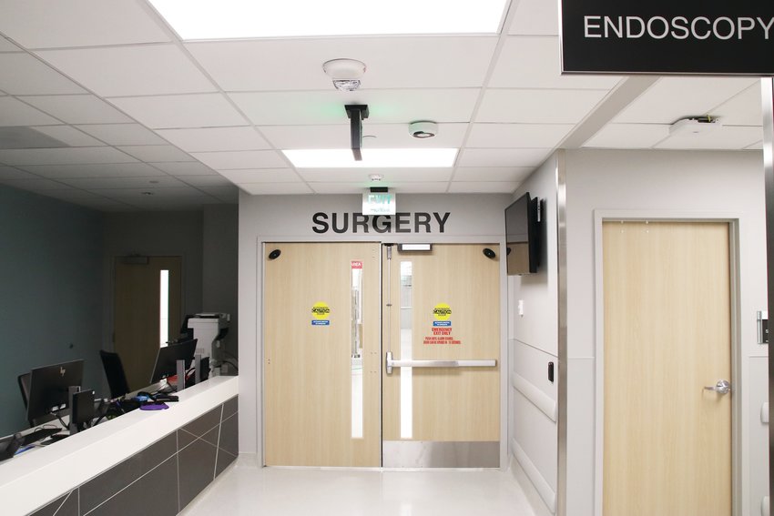 A hallway with a door to the surgery area at Centennial Hospital. A new part of the building accompanies Centennial Medical Plaza's expansion into a hospital.