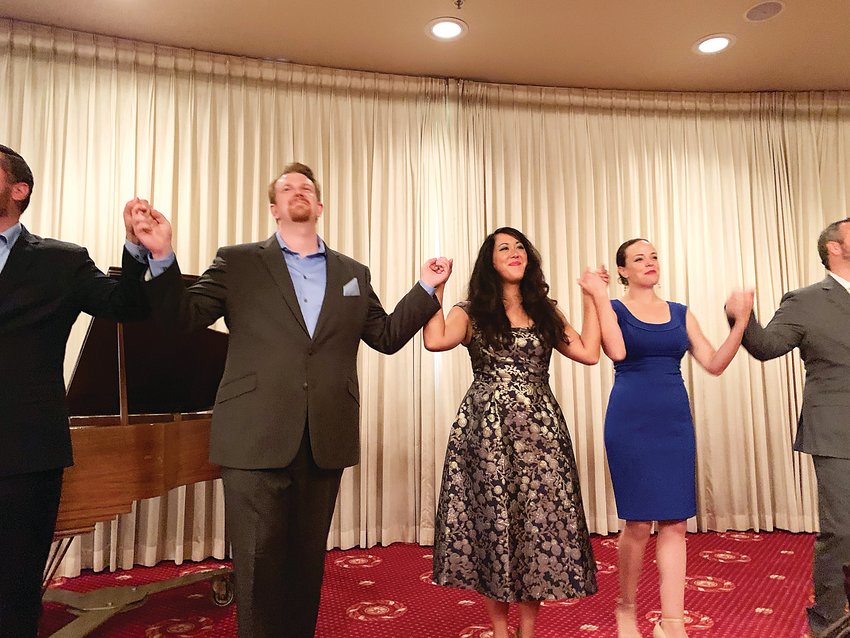 Young winners of a previous Denver Lyric Opera Guild competition sing for the guild members at a luncheon at Cherry Hills Country Club.