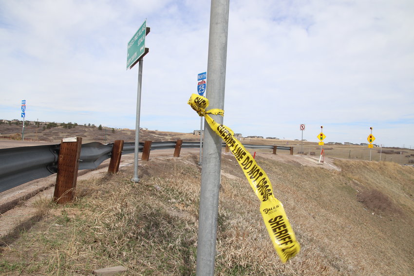 A piece of crime tape remained at the scene of a fatal officer-involved shooting April 4, 2021. The incident took place near the on ramp for I-25 N at Happy Canyon Road.