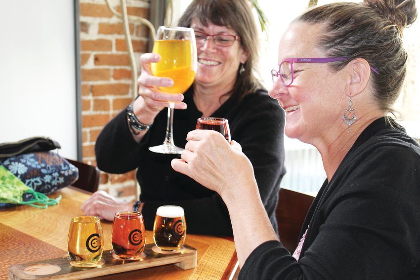Deb Evangelista, foreground, and Sarah Holloway, both of Longmont, enjoy ciders at Clear Creek Cidery & Eatery in Idaho Springs on April 20. The two were visiting the hot springs for the day and stopped by the cidery for dinner, saying they appreciate cider as a gluten-free alternative to other alcoholic drinks.