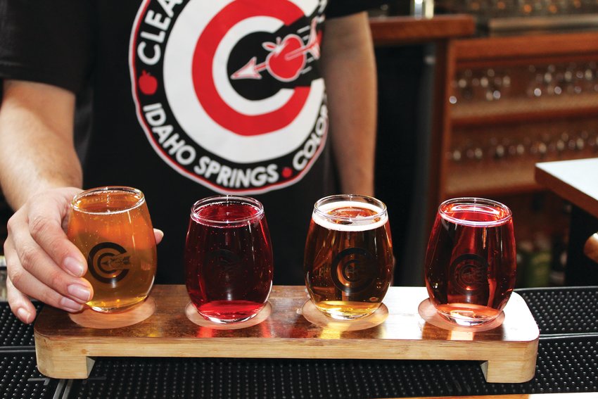 Sam Al-Jassim, a Georgetown resident and manager at Clear Creek Cidery & Eatery, pours a selection of cider for a flight of four. This cidery in Idaho Springs hopes to launch its own line of ciders later this year, and currently features nine Colorado ciders on tap and 14 others in cans.