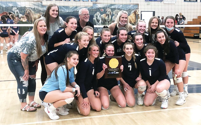 Ralston Valley volleyball team poses with the Class 5A Region 3 title April 30 at Ralston Valley High School. The Mustangs defeated Brighton and Liberty in straight sets to capture the regional title and a berth in the 8-team 5A state tournament that begins this week in Colorado Springs.