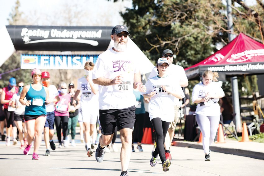 Runners take off from the 5k starting line at Hope House’s 5k and Fun Run on May 1 at Lake Arbor Park.