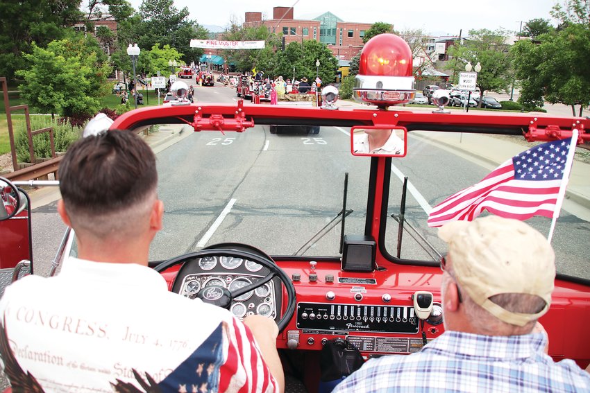 The view from atop a vintage fire truck as the Fire Muster parade rolls down Main Street.