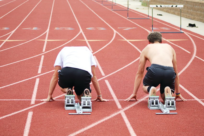 Clear Creek sprinters Evan Brandt, left, and Bode Baker line up at the starting line during Thursday’s track and field practice. Outdoor practice was cut short June 17 because of lightning in the area, so the Clear Creek track and field athletes worked in the weight room instead.