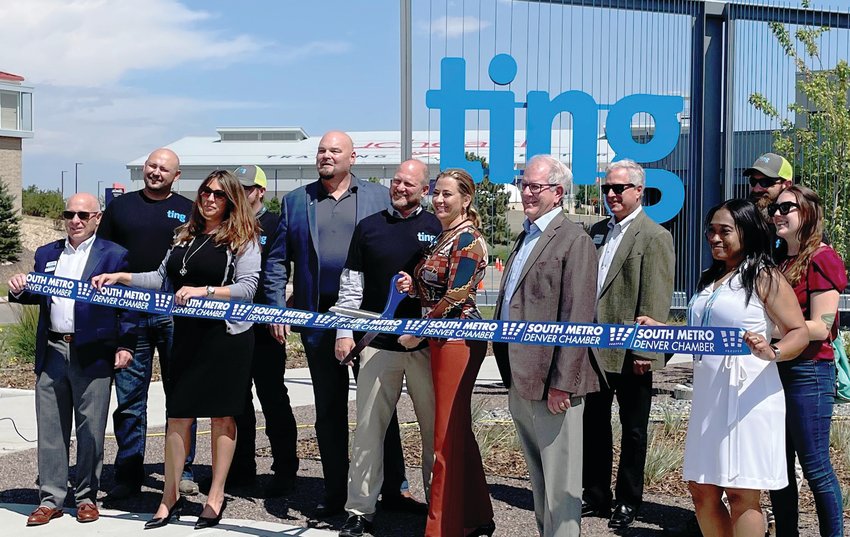 At far left, Jeff Keener, president of the South Metro Denver Chamber of Commerce; next to Keener, Matt Hogue of Ting; in the blue jacket and collared shirt, Centennial city Councilmember Richard Holt; in the middle in the black T-shirt, Mark Gotto of Ting; right of Gotto, Centennial Mayor Stephanie Piko; right of her, Councilmember Mike Sutherland; right of him, Councilmember Don Sheehan; farther right, Greg Theuret of Ting; and at front right in white, Councilmember Marlo Alston at a ribbon-cutting ceremony on Aug. 19 for the Ting Data Center. The data center sits along Broncos Parkway near Potomac Street in central Centennial.
