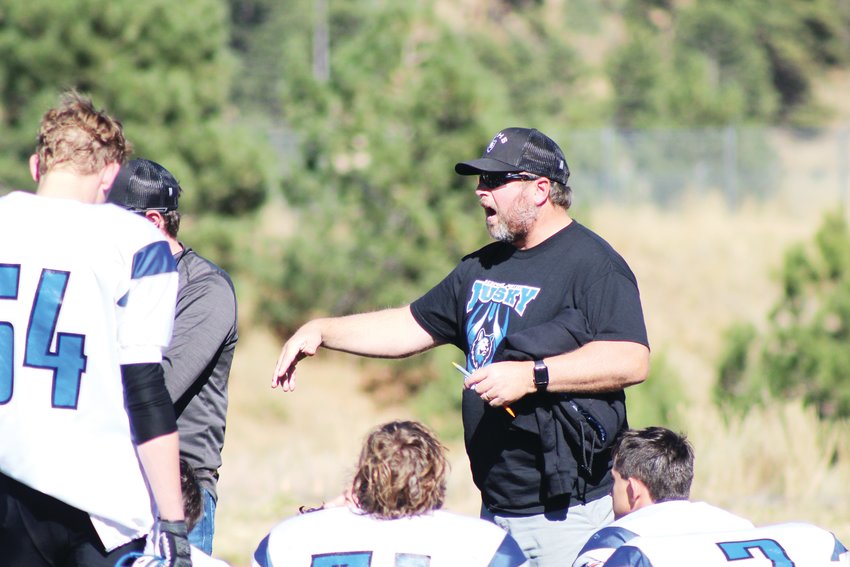 Platte Canyon coach Lance Gunkel gives directions to his team at halftime during the Oct. 16 football game at Clear Creek High School.