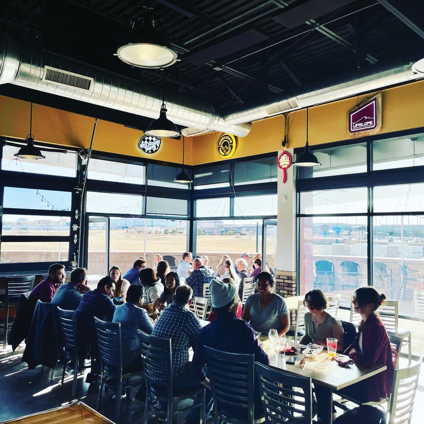 Large windows, sliding glass doors and a spacious patio make it easy for customers to enjoy the view from Max Taps’ Centennial location.