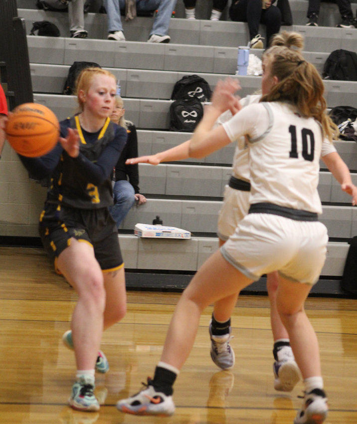 Frederick's Megan Majeres bounces a pass toward a teammate against Roosevelt's Kinsey Trujillo during a class 4A/5A Longs Peak League game Jan. 6 in Johnstown.