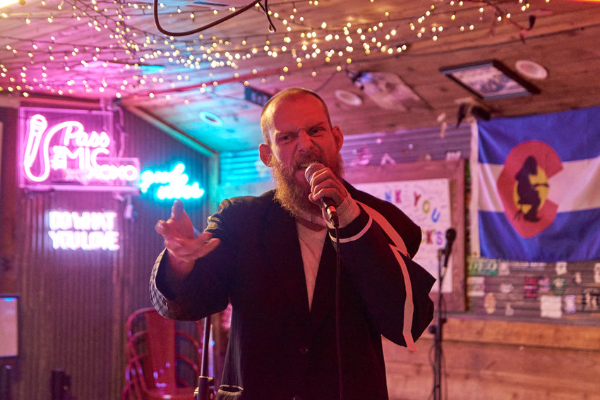 Jonathan Townshend Garner, 35, lost his legs to frostbite after spending days covered in snow while homeless. Now, he hosts open mic night at Cactus Jack's Saloon in Evergreen where he also performs.