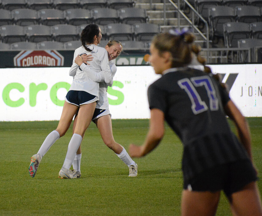 Dakota Ridge freshman Kaylie Sheehan and senior Hannah Arnold embrace after the Eagles scored on a Lutheran own-goal in the 2nd minute of the Class 4A girls soccer state championship game May 23 at Dick's Sporting Goods Park. The Eagles won 2-0 to win their first soccer title since 2003.