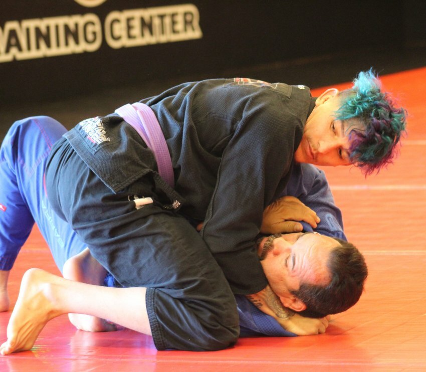 Brighton's Danthony Muniz works on his grappling technique with his coach, Eric Gutierrez, during a training session in Westminster.