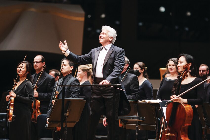 Principal Conductor Peter Oundjian addresses the crowed at a performance of the Colorado Symphony.