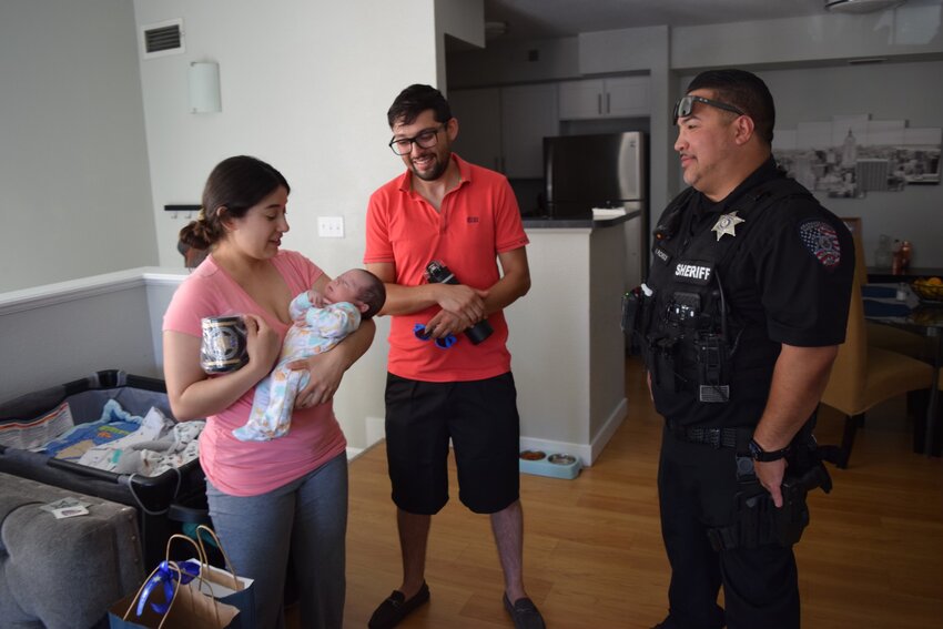 One week after saving a baby who was choking, Deputy Nicholas Pacheco returned to visit the family in Centennial.