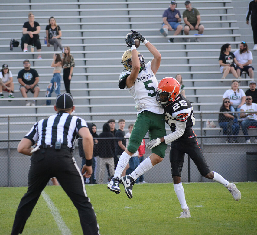 Bear Creek senior Ryan Bobick (5) hauls in his fourth touchdown of the first half behind Lakewood junior Yakob Kibler on Thursday, Aug. 24, at Jeffco Stadium. Bobick finished with five first-half touchdowns thrown by quarterback Adrian Rico in the Bears' 46-13 victory.
