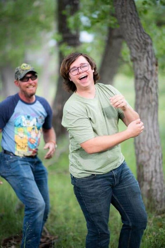 BJ Hutchinson shared this photo of her son Kris, in foreground, with his dad, Preston Wyler. Kris had returned home to work at Bernie's Kitchen in Elizabeth, and lost his life to suicide despite his manner of bringing joy to the people around him.