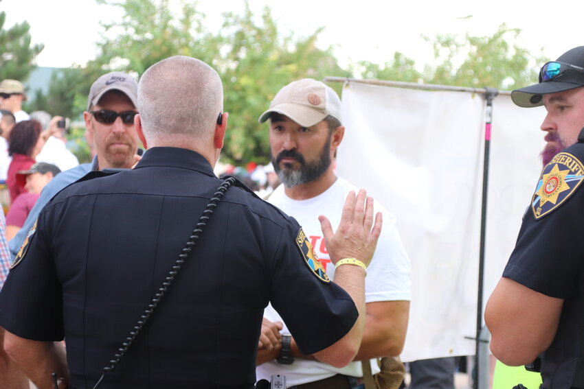 Able Shepherd CEO Jimmy Graham speaks to law enforcement at the Douglas County PrideFest on Aug. 26. No summons or arrests occurred at PrideFest and protesters were allowed to stay at the event so long as they weren’t blocking the show.