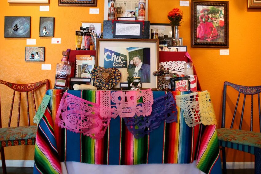 This file photo from 2015 is of an altar set up at the CHAC Gallery for one of the venue’s previous exhibits. It honors Carlos Martinez, the former director of CHAC Gallery, who passed away in 2005.