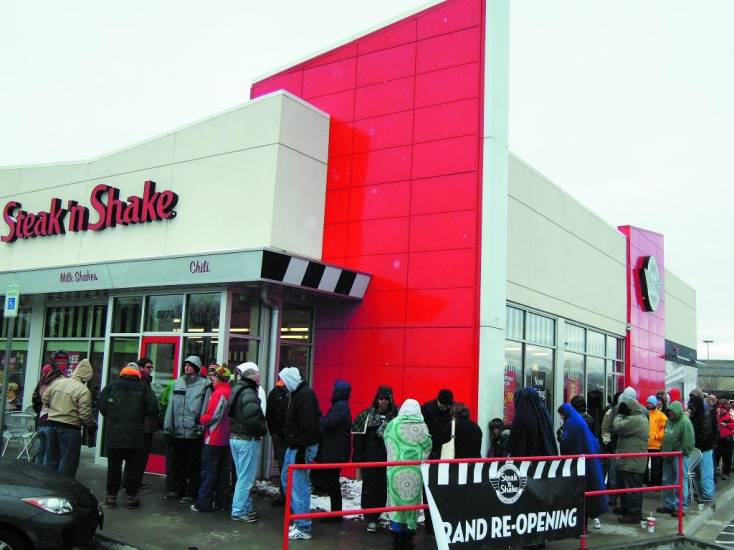 Several hundred people lined up outside the Cetennial Steak ‘n Shake restaurant on a wet, blustery morning Nov. 25. The crowd was hoping to take advantage of the company’s offer of “free Steak ‘n Shake for a year” to the first 100 customers.