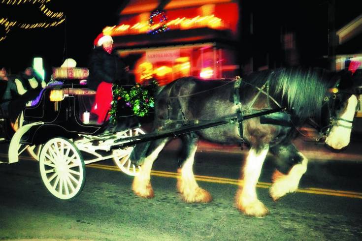 Horse-drawn carriages drove Lagniappe attendees around Olde Town in Christmas style.