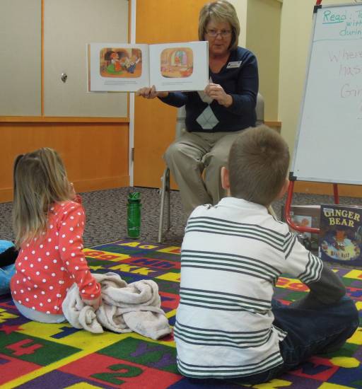 Stephanie Rogers of Douglas County Libraries reads to children during a Dec. 26 story hour at the Highlands Ranch library.