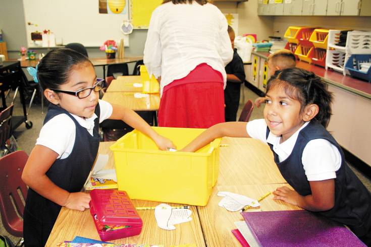 Students at Monterey Community School divvy up supplies for a class lesson on the first day of school. Mapleton Public Schools kicked off its Attendance Campaign at the beginning of the school year, and has engaged parents in conversations about the importance of attendance at all parent teacher conferences, family nights and other events. Photo provided by Mapleton Public Schools