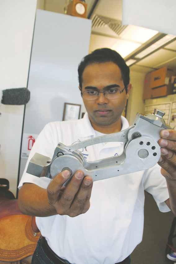 Barath Murali, a mechanical engineering student at Colorado School of Mines, shows the project that he and his team worked on for a former Dancing with the Stars competitor — a dancing foot prosthesis. Working with Murali on the project is Megan Auger, Chelsea Gibas, Abby Reuland, Adam Laine and Ashlyn Eitemiller.