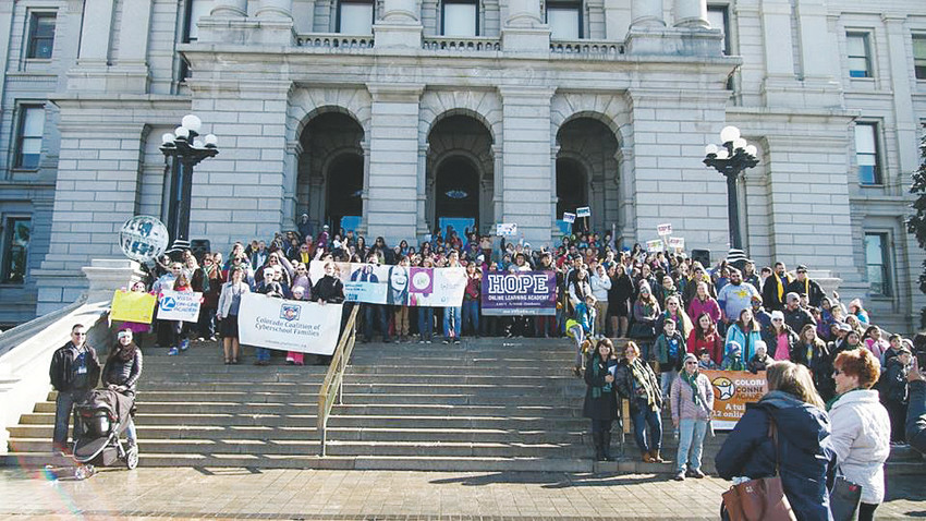 Parents, students and educators rally at the state Capitol in Denver on Feb. 16 to raise awareness about online learning.