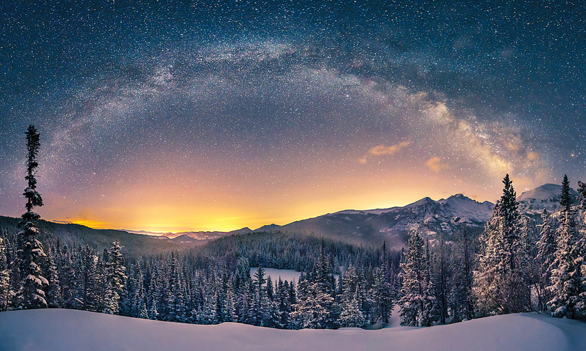 The Milky Way over Longs Peak from the Emerald Lake Trail after an April snowstorm, Rocky Mountain National Park, Colorado.