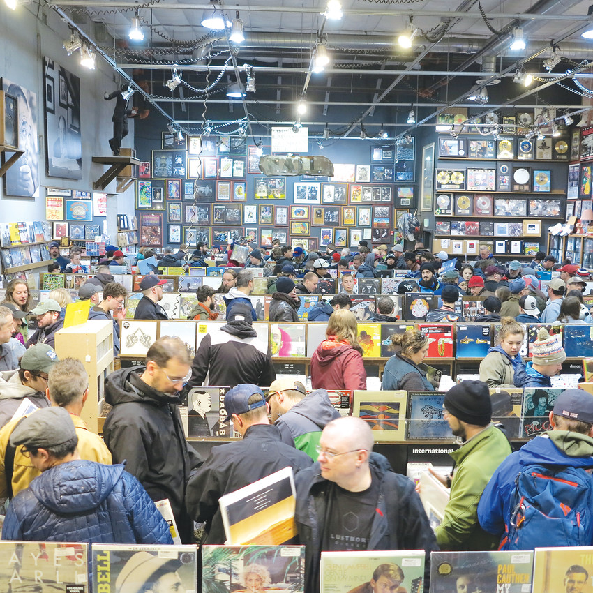 Shoppers wait in line at Twist and Shout Records with their Record Store Day purchases. The event is the biggest day of the year for most record stores, and employees are trained to make the process as smooth as possible.