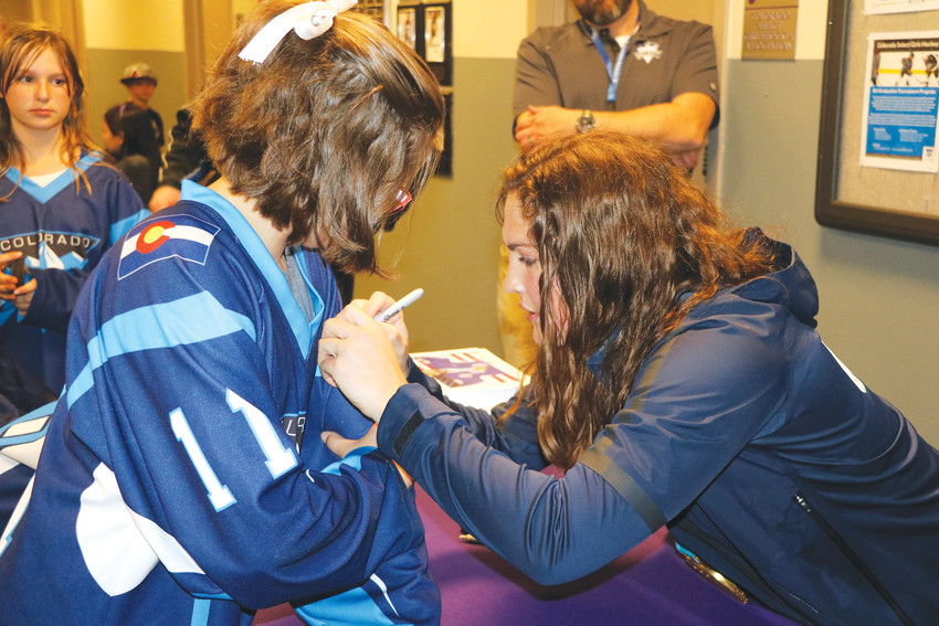 Gold-medal winner Nicole Hensley returned to the south Jeffco area for a skating event and to meet her fans on April 15. She signed autographs for a long line of fans such as 11-year-old Emily Levesque.
