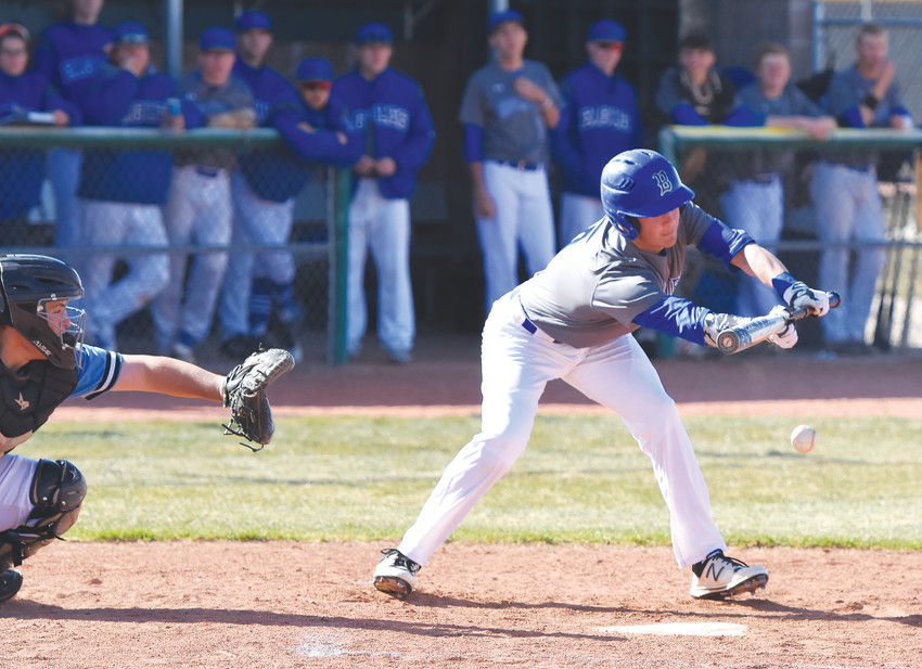 Broomfield’s Ben Peterson attempts to lay down a bunt during an April 18 game at Mountain Range High School in Westminster.