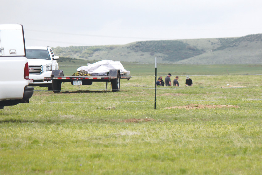 Investigators comb the debris field of the deadly plane May 11, plane crash near the Stepping Stone neighborhood.