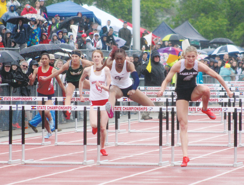 Rock Canyon's Emily Sloan, right, wins her fourth straight 100-meter hurdles title at the state high school track championships held May 17-19 at Jeffco Stadium. Sloan also won the 300 hurdles.