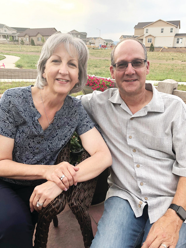 Dave and Leslie Samson, the 29th homeowners in Sterling Ranch, sit in the backyard of their one-story house. Both widowed, the Samsons married five years ago and wanted to buy a place of their own. "We get to enjoy it and we know there is not another move in our future,” said Leslie Samson.